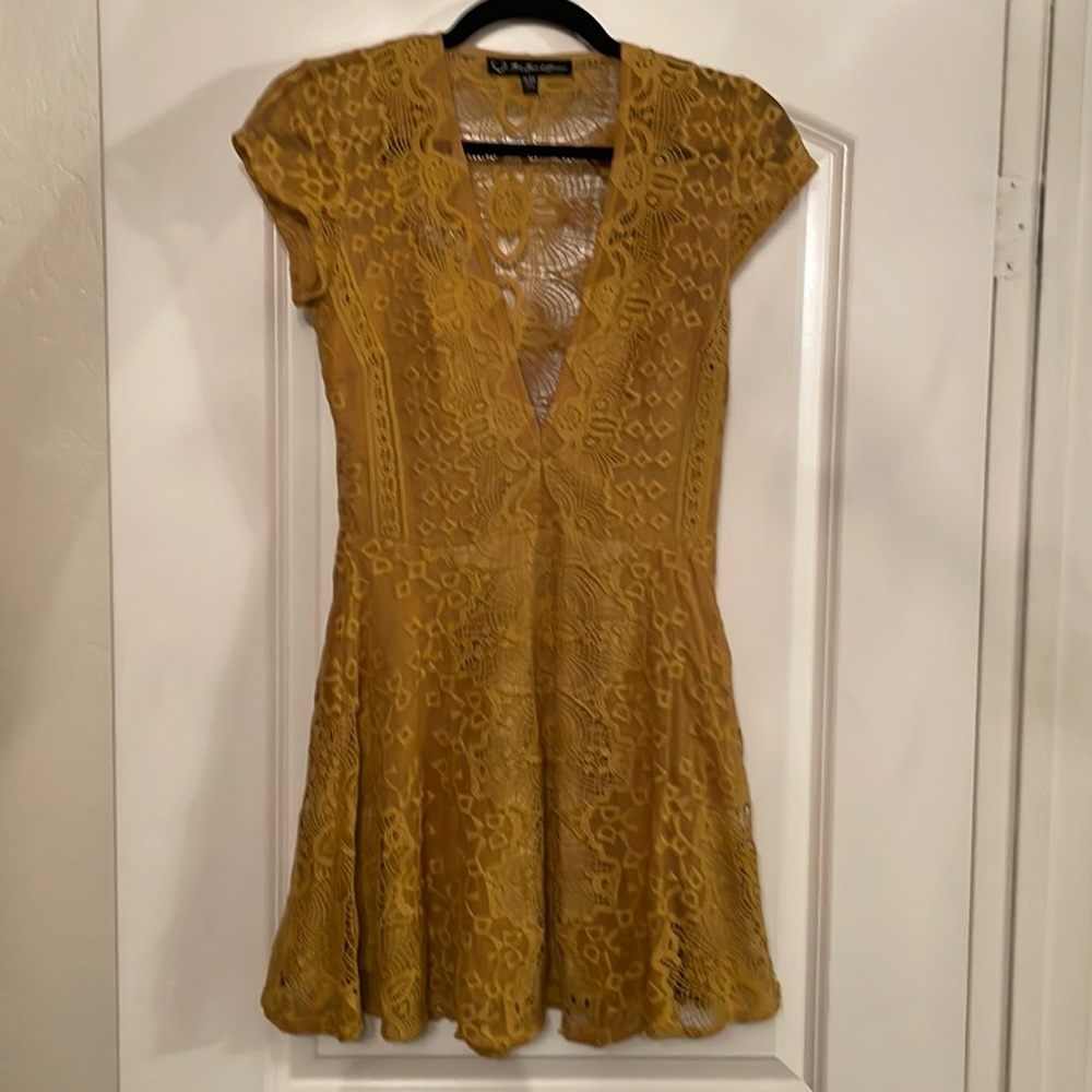 For love and lemons dress in a mustard yellow